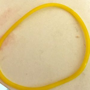 A yellow fendi bracelet